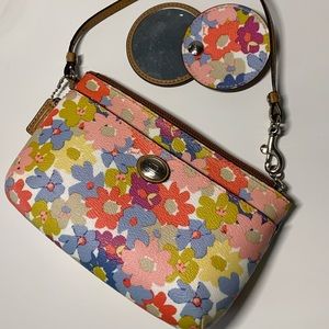 Coach wristlet with a mirror